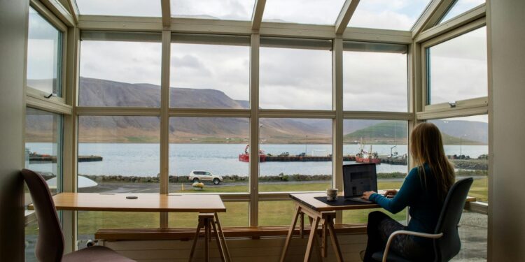 The Role of Online Faxing in Remote Work: Keeping Your Business Connected 1 Woman using a software tool for online faxing at a cafe